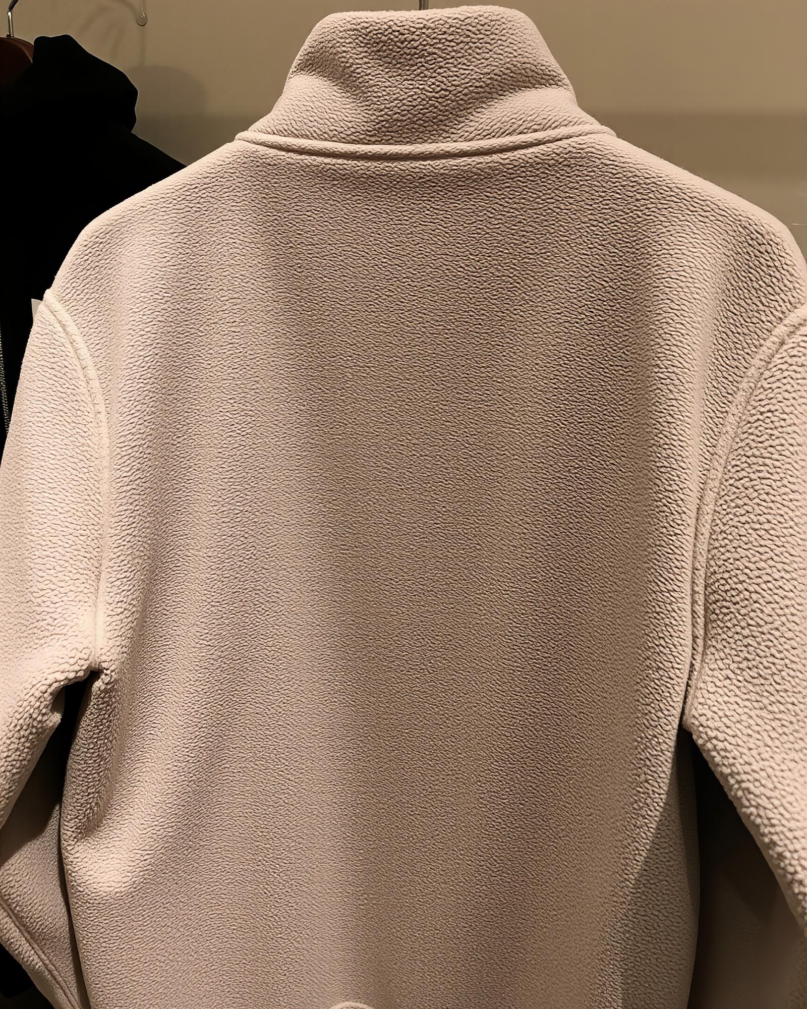 embroidered linen jacket back with tonal crest